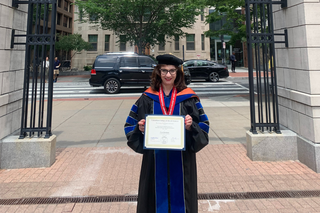 Fran Buntman holding award certificate