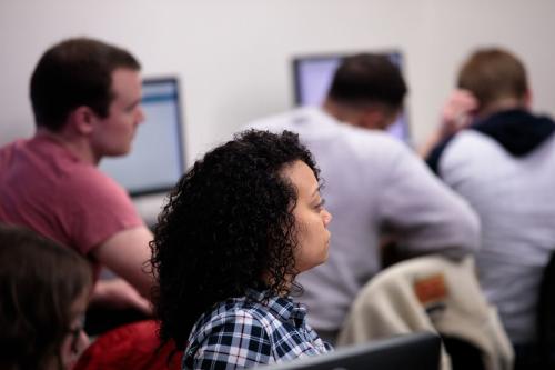 2 students listening in a sociology class room